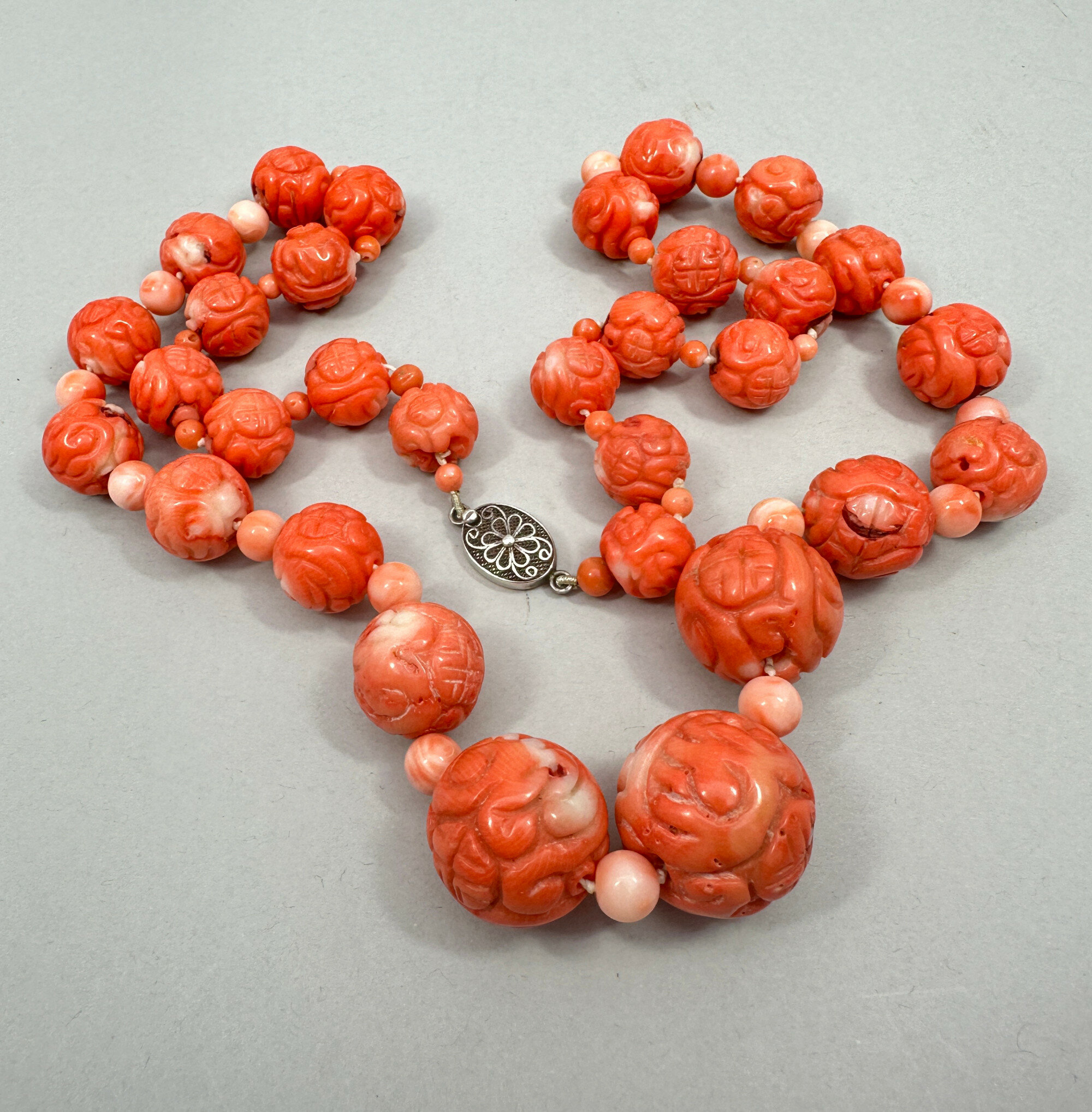 Carved coral beads clearance